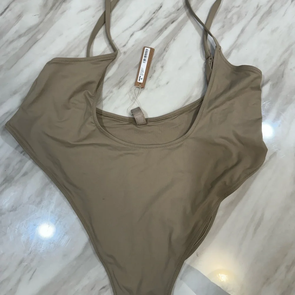 Skims swim cut out open bust one piece size 4x